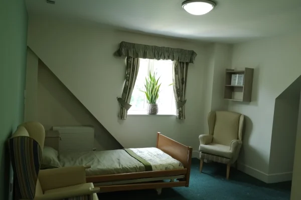 Staff member assisting a resident at Moreland House Care Home